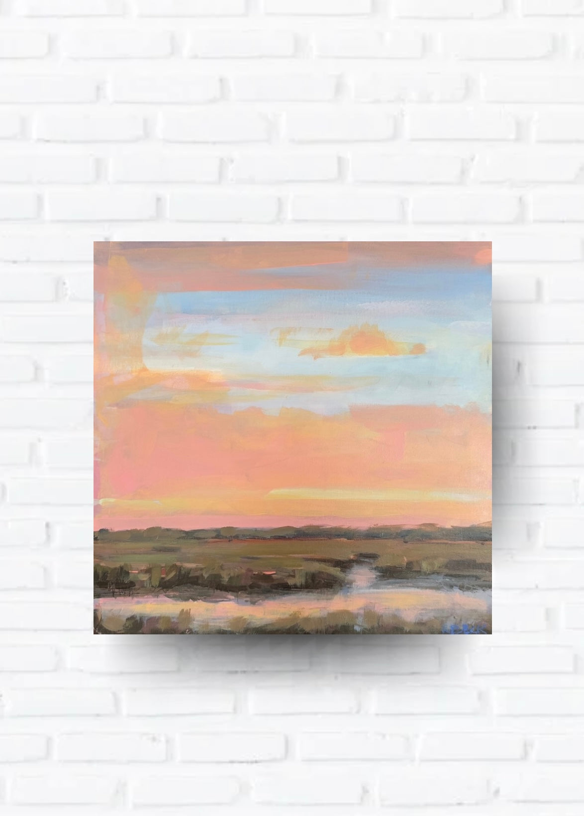 Rose Light original square coastal sunset marsh painting by Charleston artist Ryan Beck hanging in a neutral coastal living room with layered artful decor